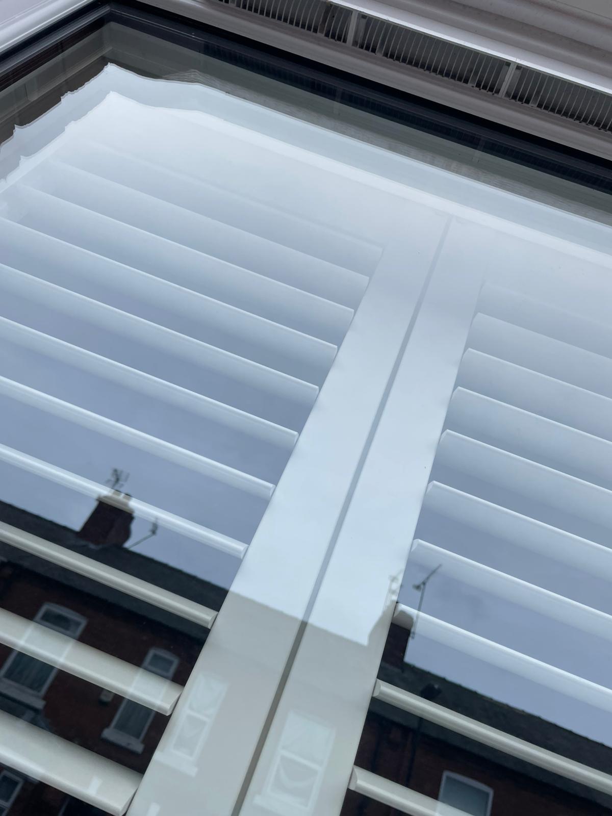 Spotless clean window with shutters — after clean